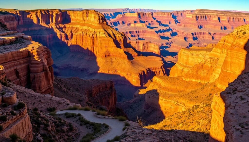 Towering sandstone cliffs, carved by the mighty Colorado River, stretch across a vast, awe-inspiring landscape. Warm, golden light bathes the rugged terrain, casting dramatic shadows that accentuate the canyon's intricate geological features. In the foreground, a winding trail leads the eye towards the canyon's depths, inviting exploration. The middle ground showcases the canyon's immense scale, with layered rock formations and distant mesas creating a sense of depth and grandeur. The background is dominated by a clear, azure sky, creating a harmonious contrast with the earthy tones of the canyon. Capture the essence of this iconic natural wonder, a testament to the power of geological forces and the beauty of the American Southwest.